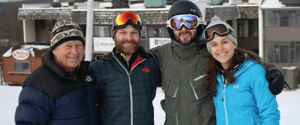 The DesLauriers Family Poses in front of the lodge at Bolton Valley