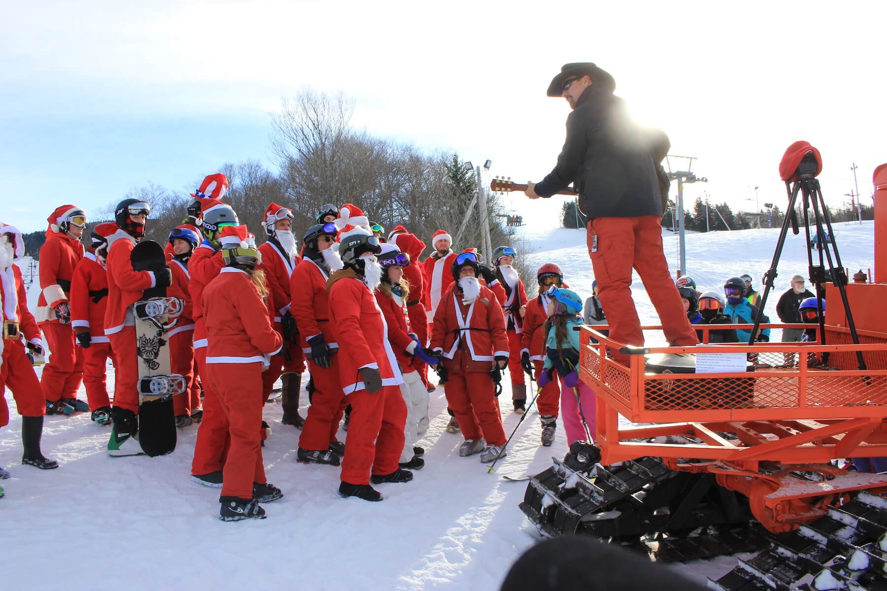 Jamie Lee Thurston Plays guitar to santa clause at Bolton Valley