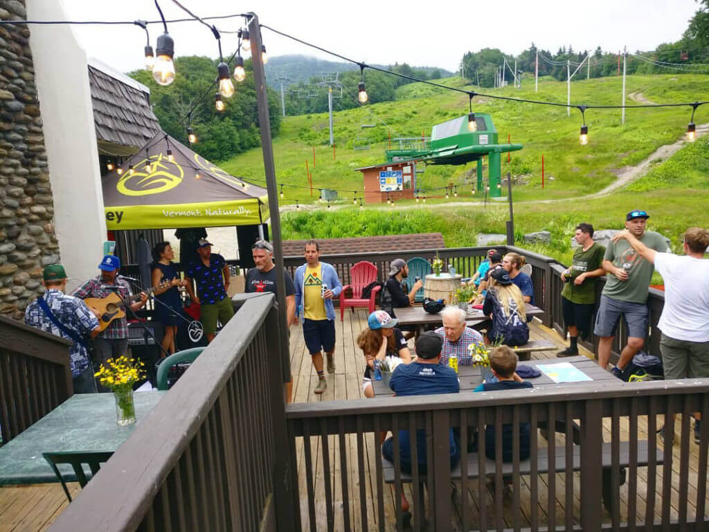 People enjoying a beer festival at Bolton Valley in the summer