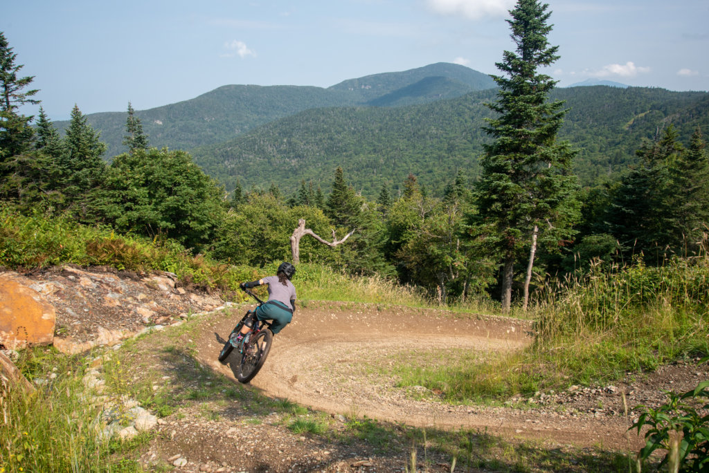 To display a woman mountain biking