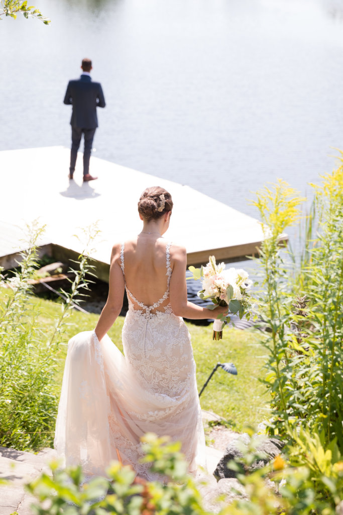A Bride Walks Down To Greet Her Groom on her Wedding Day at The Ponds