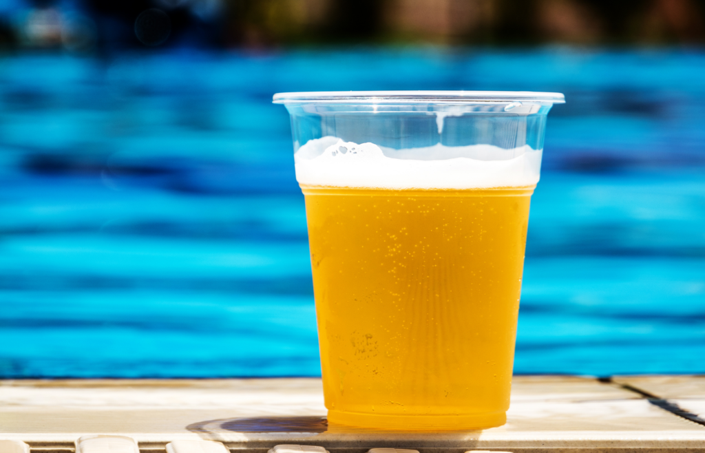 Cold draft beer on deck in front of pool