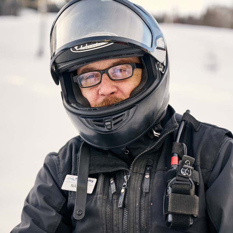 Headshot of an Employee with Snowmobile Helmet on