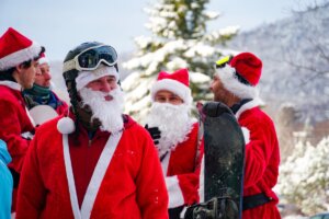 Folks dressed up in Santa costumes take to the ski slopes