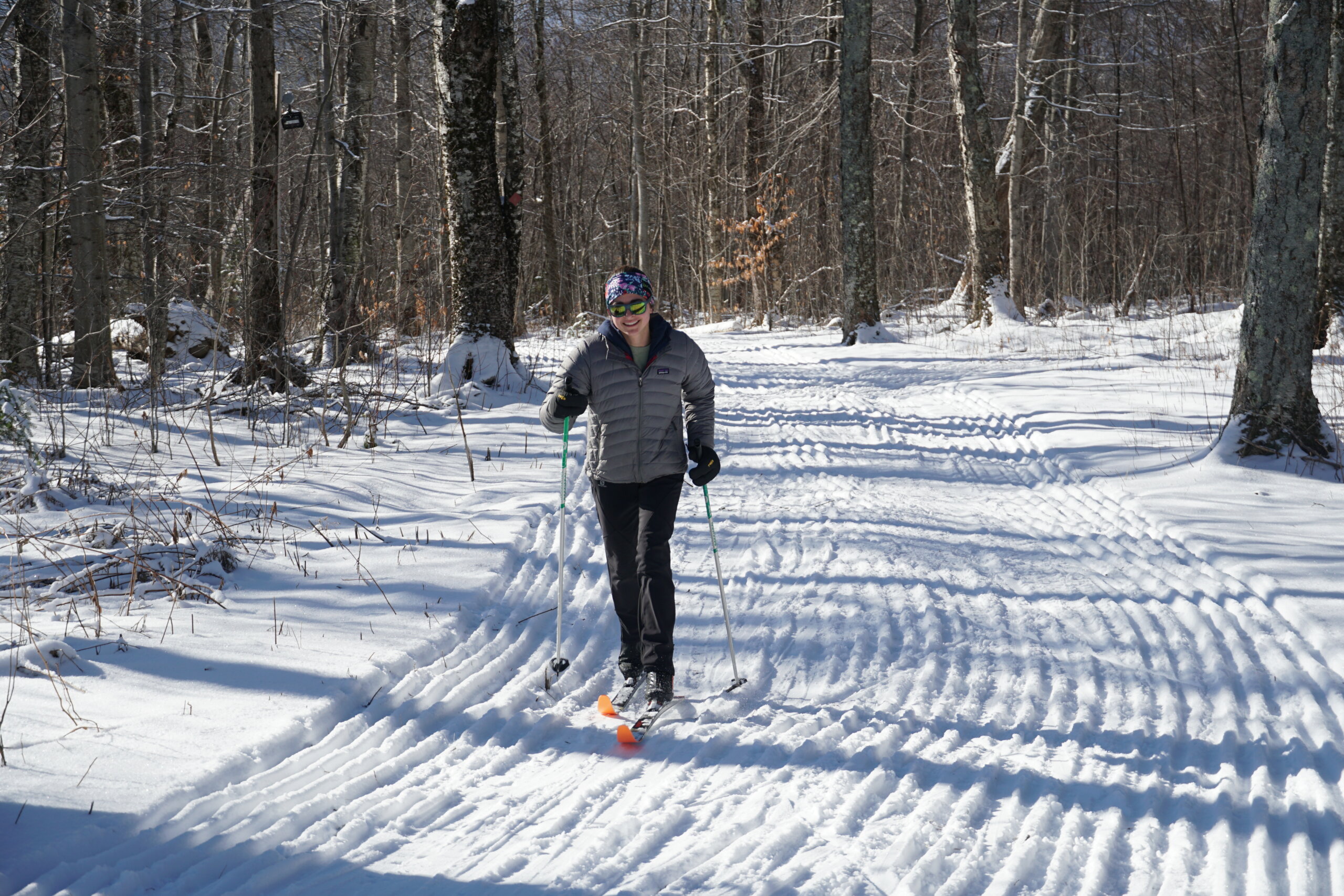 Woman on cross country skis on groomed trails