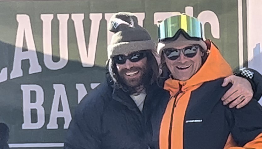 2 snowboarders cheesing for the camera