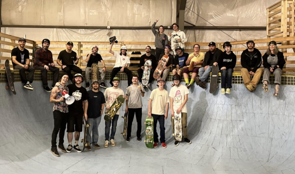 skateboarders pose in the blue skate bowl made legendary by Talent skatepark in Burlington and Bolton Valley's (now gone) skatepark