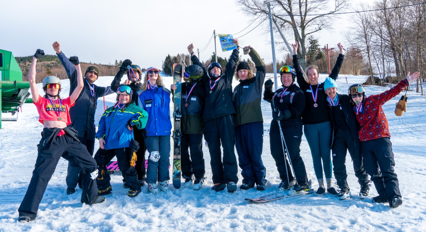 skiers and riders pose with their racing medals won